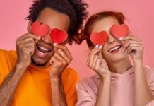 From Attic Start-Up to One of the Leading Companies in the Sexual Wellness Industry interracial couple holding paper hearts before their eyes