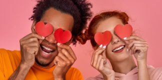 From Attic Start-Up to One of the Leading Companies in the Sexual Wellness Industry interracial couple holding paper hearts before their eyes