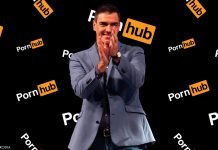 Spain to Lock Down Adult Content for Minors parody image of Pedro Sanchez standing in front of a pornhub photo wall